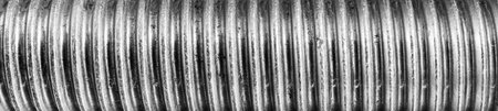 Texture of metal bolt thread. Abstract banner for design.の写真素材