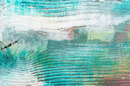 Colorful painted textured wooden plank with a paint stains. Abstract background for design.の写真素材