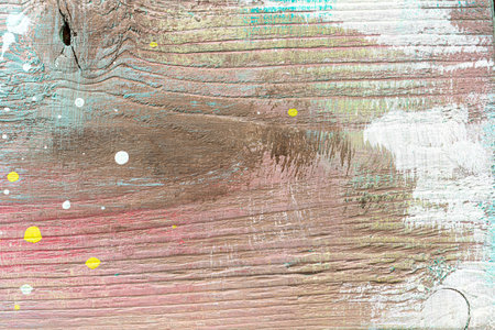 Colorful painted textured wooden plank with a paint stains. Abstract background for design.の写真素材