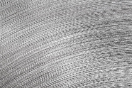 Monochrome texture of shiny scratched metal. Abstract background for design.の写真素材
