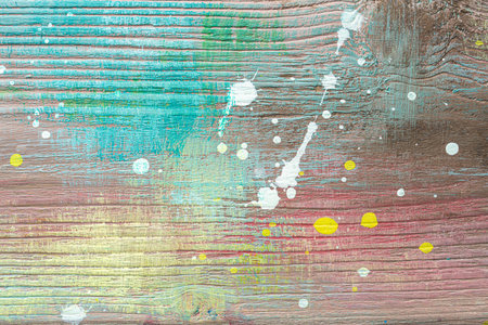 Colorful painted textured wooden plank with a paint stains. Abstract background for design.の写真素材