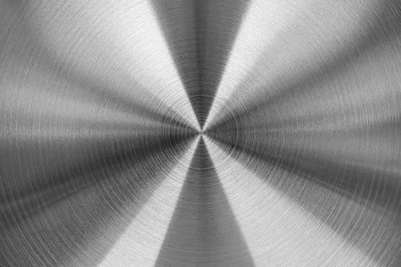 Stainless steel or aluminum circular brushed shiny metal texture. Abstract metallic background for design. Circle shape.の写真素材