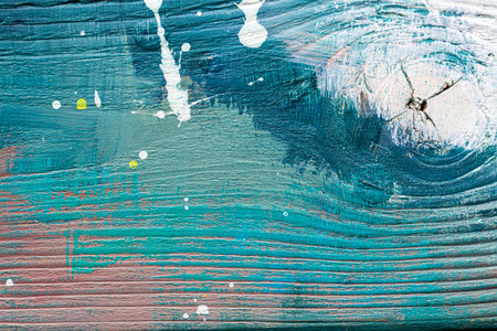 Colorful painted textured wooden plank with a paint stains. Abstract background for design.の写真素材