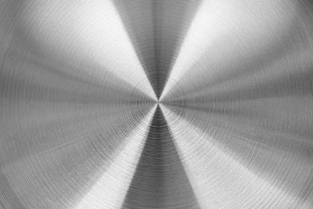 Stainless steel or aluminum circular brushed shiny metal texture. Abstract metallic background for design. Circle shape.の写真素材