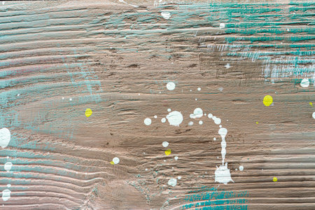 Colorful painted textured wooden plank with a paint stains. Abstract background for design.の写真素材