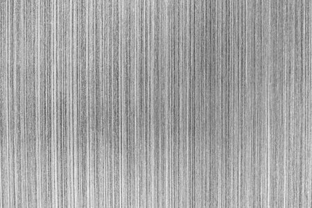 Monochrome texture of shiny scratched metal. Abstract background for design.の写真素材
