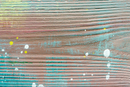 Colorful painted textured wooden plank with a paint stains. Abstract background for design.の写真素材