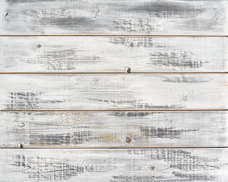 White painted textured wooden plank table top. Abstract background for design.の写真素材