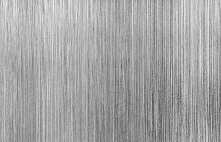 Monochrome texture of shiny scratched metal. Abstract background for design.の写真素材