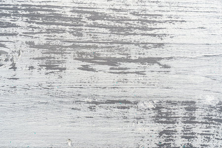 White and gray painted textured wooden plank. Abstract background for design.の写真素材