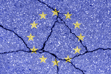European Union flag on cracked concrete wall. The concept of political crisis, default, economic collapse, conflict, terrorism or other problems in the country. Abstract disaster symbol.の写真素材