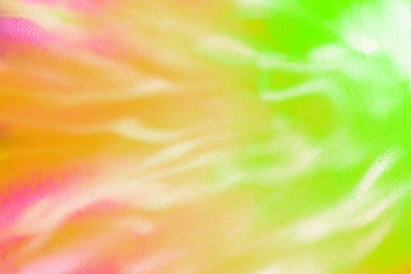 A fragment of colorful graffiti painted on a wall. Abstract urban background for design. Spray painting art.の写真素材