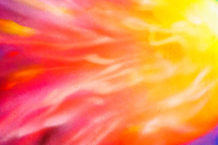 A fragment of colorful graffiti painted on a wall. Abstract urban background for design. Spray painting art.の写真素材