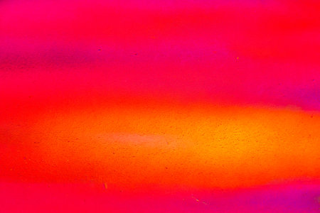 A fragment of colorful graffiti painted on a wall. Abstract urban background for design. Spray painting art.の写真素材