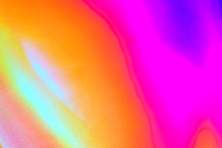 A fragment of colorful graffiti painted on a wall. Abstract urban background for design.の写真素材