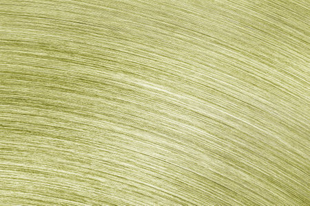 Golden texture of shiny scratched metal. Abstract metallic background for design.の写真素材