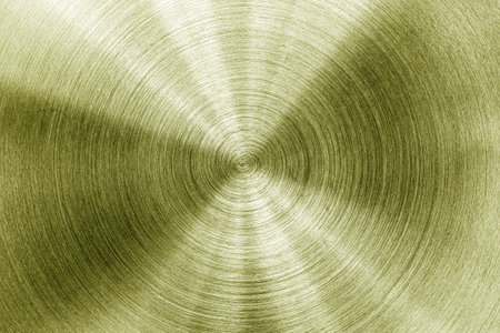 Golden circular brushed shiny metal texture. Abstract metallic background for design. Circle shape.の写真素材