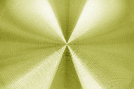 Golden circular brushed shiny metal texture. Abstract metallic background for design. Circle shape.の写真素材