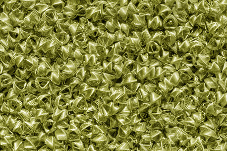 Background of bronze wires twisted into spirals in the form of prisms. Spiral-prismatic nozzle. Abstract metallic background for design.の写真素材