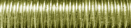 Texture of golden bolt thread. Abstract metallic banner for design.の写真素材