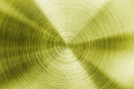 Golden circular brushed shiny metal texture. Abstract metallic background for design. Circle shape.の写真素材