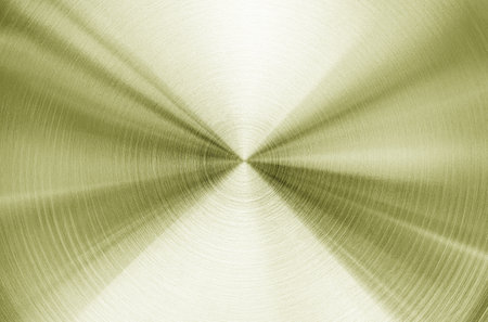 Golden circular brushed shiny metal texture. Abstract metallic background for design. Circle shape.の写真素材