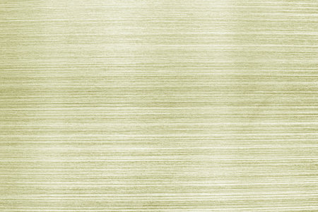 Golden texture of shiny scratched metal. Abstract metallic background.の写真素材
