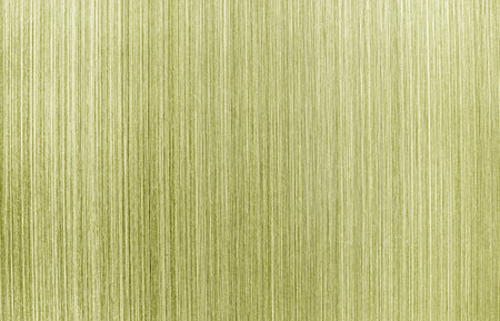 Golden texture of shiny scratched metal. Abstract metallic background for design.の写真素材