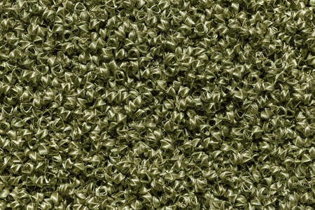 Background of bronze wires twisted into spirals in the form of prisms. Spiral-prismatic nozzle. Abstract metallic background for design.の写真素材