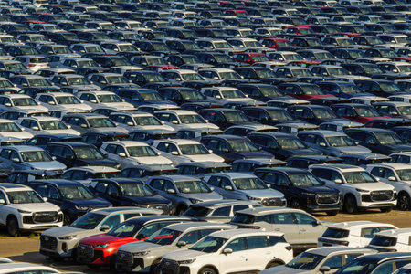 Russia, Kaluga, AGR Automotive Group - July 7, 2025: Rows of new cars parked close together in a...