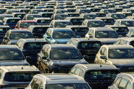 Russia, Kaluga, AGR Automotive Group - July 7, 2025: Rows of new cars parked close together in a...