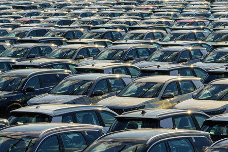 Russia, Kaluga, AGR Automotive Group - July 7, 2025: Rows of new cars parked close together in a...