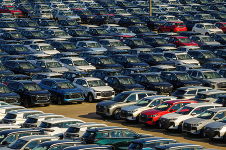 Russia, Kaluga, AGR Automotive Group - July 7, 2025: Rows of new cars parked close together in a...