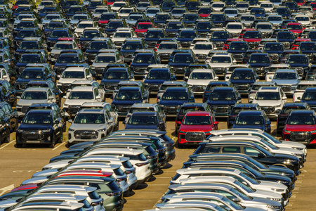 Russia, Kaluga, AGR Automotive Group - July 7, 2025: Rows of new cars parked close together in a...