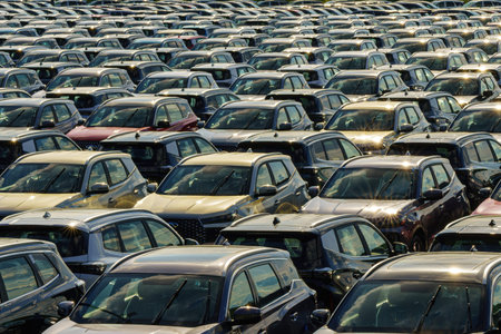 Russia, Kaluga, AGR Automotive Group - July 7, 2025: Rows of new cars parked close together in a...