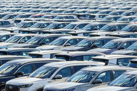 Russia, Kaluga, AGR Automotive Group - July 7, 2025: Rows of new cars parked close together in a...