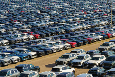 Russia, Kaluga, AGR Automotive Group - July 7, 2025: Rows of new cars parked close together in a...