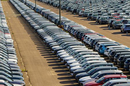 Russia, Kaluga, AGR Automotive Group - July 7, 2025: Rows of new cars parked close together in a...