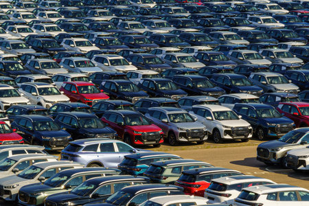 Russia, Kaluga, AGR Automotive Group - July 7, 2025: Rows of new cars parked close together in a...