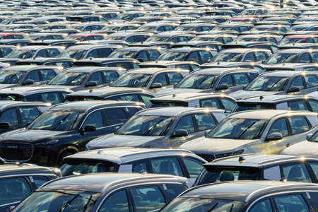 Russia, Kaluga, AGR Automotive Group - July 7, 2025: Rows of new cars parked close together in a...