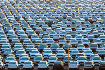 Russia, Kaluga - January 11, 2022 - New cars parked in rows at a terminal in winter. Automobile...