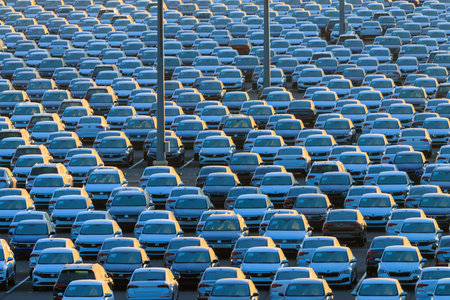 Russia, Kaluga - January 11, 2022 - New cars parked in rows at a terminal in winter. Automobile industry production and export concept. Supply chain logistics.のeditorial素材