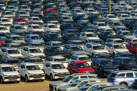 Russia, Kaluga, AGR Automotive Group - July 7, 2025: Rows of new cars parked close together in a...