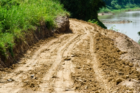 Country road in an agricultural  The road has been damaged by flooding の写真素材
