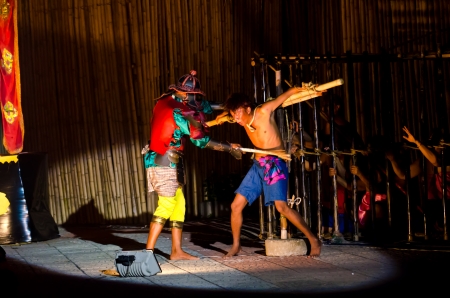SING BURI, THAILAND - FEBRUARY 6: Unidentified actors perform at the Thai traditional combat in the...