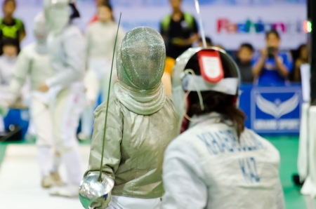BANGKOK - MARCH 10: Unidentified Fencing Athletic fight against of Asian Junior & Cadet Fencing Championships 2013 on March 9, 2013 in Bangkok, Thailand.のeditorial素材