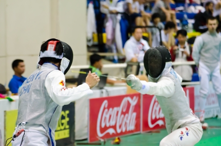 BANGKOK - MARCH 10: Unidentified Fencing Athletic fight against of Asian Junior & Cadet Fencing Championships 2013 on March 9, 2013 in Bangkok, Thailand.のeditorial素材