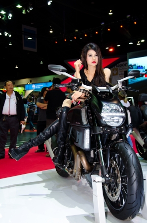 BANGKOK - MARCH 28 : The Ducati Diavel Strada motorcycle with unidentified model on display at The 34th Bangkok International Motor Show 2013 on March 28, 2013 in Bangkok, Thailand.のeditorial素材