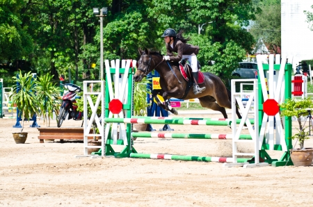 CHON BURI, THAILAND - APRIL 27: Unidentified Equestrian with horse at The 11th competition Nawamintr Cup "Queen's Cup" on April 27, 2013 in Chon Buri, Thailand.のeditorial素材