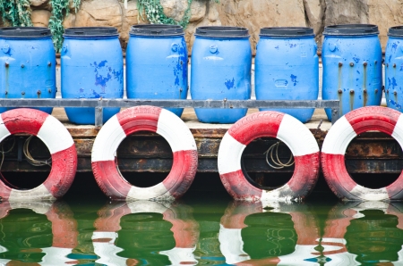 Hazardous and Toxic Waste Barrels storing pollution in the harbor の写真素材